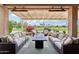 Relaxing covered patio perfect for entertaining and enjoying golf course views at 16077 W Vale Dr, Goodyear, AZ 85395