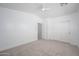 Bright carpeted bedroom with closet and neutral tones, creating a serene and inviting atmosphere at 17610 N 17Th Pl # 2, Phoenix, AZ 85022