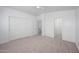Spacious carpeted bedroom with large closets and neutral tones, ideal for creating a serene retreat at 17610 N 17Th Pl # 2, Phoenix, AZ 85022