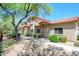 Beautiful townhomes with manicured desert landscaping, covered entrances, and red tile roofs at 17610 N 17Th Pl # 2, Phoenix, AZ 85022