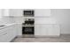Close-up of a well-appointed kitchen features stainless steel appliances and white cabinets at 17610 N 17Th Pl # 2, Phoenix, AZ 85022