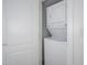 Conveniently located laundry closet with stacked washer and dryer, optimizing space and functionality at 17610 N 17Th Pl # 2, Phoenix, AZ 85022