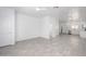 Bright, open living space featuring light gray wood-look tile, white walls, and ceiling fans for a modern, airy feel at 17610 N 17Th Pl # 2, Phoenix, AZ 85022