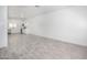 Spacious living room featuring recessed lighting, a ceiling fan, tile floors, and a view of the kitchen at 17610 N 17Th Pl # 2, Phoenix, AZ 85022