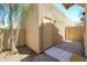 Beige exterior detail shows the side yard gravel landscaping with a door to the building at 17610 N 17Th Pl # 2, Phoenix, AZ 85022