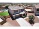 Aerial view of a two-story home with a spacious backyard, manicured lawn, and covered front porch at 18351 W Southgate Ave, Goodyear, AZ 85338
