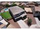 Aerial view of a two-story home with a pool, lawn, and desert-friendly landscaping in a suburban neighborhood at 18351 W Southgate Ave, Goodyear, AZ 85338