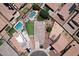 Bird's-eye view of a home with backyard pool, patio, manicured lawn, and desert landscaping at 18351 W Southgate Ave, Goodyear, AZ 85338