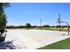 Community basketball court with well-maintained concrete surface and surrounding landscaping at 18351 W Southgate Ave, Goodyear, AZ 85338