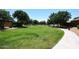 Lush green community park with walking paths, mature trees and well-maintained landscaping at 18351 W Southgate Ave, Goodyear, AZ 85338