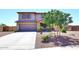 Charming two-story home with a well-manicured front yard and attached two-car garage at 18351 W Southgate Ave, Goodyear, AZ 85338
