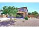 Inviting two-story home with desert landscaping, stone accents, and covered porch at 18351 W Southgate Ave, Goodyear, AZ 85338
