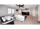 Game room with an air hockey table and multiple seating areas at 18351 W Southgate Ave, Goodyear, AZ 85338