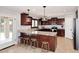 Kitchen features granite countertops, stainless steel appliances, and a breakfast bar at 18351 W Southgate Ave, Goodyear, AZ 85338