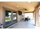 Covered patio with ceiling fan, outdoor seating, and views of the pool at 18351 W Southgate Ave, Goodyear, AZ 85338