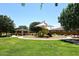 Community playground featuring modern play structures, picnic tables and sun shades at 18351 W Southgate Ave, Goodyear, AZ 85338