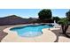 Sparkling pool with water feature, mature landscaping and ample space for relaxation at 18351 W Southgate Ave, Goodyear, AZ 85338