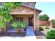 Charming front porch with stone pillars, decorative details, and comfortable seating at 18351 W Southgate Ave, Goodyear, AZ 85338