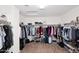 Large walk-in closet with ample hanging space and shelving for optimal storage at 18351 W Southgate Ave, Goodyear, AZ 85338