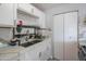 The kitchen sink features white countertops with a modern faucet and fixtures perfect for cooking and cleaning at 1861 N 63Rd Ave, Phoenix, AZ 85035