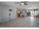 Spacious open concept living area flows into kitchen, complete with tile floors, for seamless living and entertaining at 1861 N 63Rd Ave, Phoenix, AZ 85035