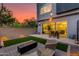 Stylish outdoor area with a built-in fire pit, artificial grass, and outdoor seating at 1910 W Desert Hollow Dr, Phoenix, AZ 85085