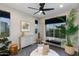 Serene bedroom with a cozy bench, bright windows, and natural decorations at 1910 W Desert Hollow Dr, Phoenix, AZ 85085