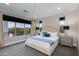 Bright bedroom with large windows offering beautiful outdoor views and modern furnishings at 1910 W Desert Hollow Dr, Phoenix, AZ 85085