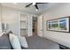 Bedroom with a walk in closet and doorway leading to another room at 1910 W Desert Hollow Dr, Phoenix, AZ 85085