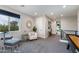 Spacious game room with a bar-height table, comfortable seating, and views of the landscape at 1910 W Desert Hollow Dr, Phoenix, AZ 85085