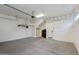 Clean, two-car garage with door and ceiling mounted storage racks at 1910 W Desert Hollow Dr, Phoenix, AZ 85085