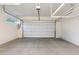 Spacious two car garage with ample ceiling storage and epoxy floor finish at 1910 W Desert Hollow Dr, Phoenix, AZ 85085