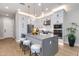 Well-equipped kitchen with white cabinets, granite countertops, and a functional island at 1910 W Desert Hollow Dr, Phoenix, AZ 85085