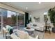 Bright living room with sliding glass doors to backyard, offering seamless indoor-outdoor living at 1910 W Desert Hollow Dr, Phoenix, AZ 85085
