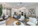 Bright living room featuring modern furnishings, an open floor plan, and a stylish kitchen with a center island at 1910 W Desert Hollow Dr, Phoenix, AZ 85085