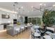 Open-concept living space featuring a modern kitchen, dining area, and bright living room at 1910 W Desert Hollow Dr, Phoenix, AZ 85085