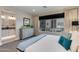 Comfortable main bedroom with a modern dresser and a view to an ensuite bathroom at 1910 W Desert Hollow Dr, Phoenix, AZ 85085