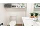 Bright bathroom with floating shelves, potted plants, and quartz countertop sink at 20 S Buena Vista Ave # 111, Gilbert, AZ 85296