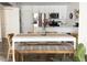Bright dining area featuring a white table, stylish seating, and an open layout to the kitchen at 20 S Buena Vista Ave # 111, Gilbert, AZ 85296