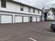 A parking lot with individual garages, providing convenient and secure parking spaces for residents at 20 S Buena Vista Ave # 111, Gilbert, AZ 85296