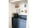Cozy laundry closet with front loading washer and dryer and ample shelving at 20 S Buena Vista Ave # 111, Gilbert, AZ 85296