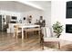 Modern living area showcasing wood floors, an open floor plan, and stylish, neutral decor with abundant natural light at 20 S Buena Vista Ave # 111, Gilbert, AZ 85296