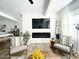 A wide view of the living area, featuring a modern fireplace, flat screen tv, and cozy seating at 20 S Buena Vista Ave # 111, Gilbert, AZ 85296