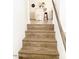 View up staircase featuring wood stairs leading to second level of home at 20 S Buena Vista Ave # 111, Gilbert, AZ 85296