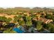 Scenic aerial view of homes and community pool with mountain views in background at 20750 N 87Th St # 2115, Scottsdale, AZ 85255
