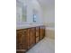 Bathroom showcasing double sinks with wood cabinets and a soaking tub for a spa-like experience at 20750 N 87Th St # 2115, Scottsdale, AZ 85255