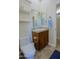 Bathroom with wood vanity, white countertops, and dual vanity mirrors at 20750 N 87Th St # 2115, Scottsdale, AZ 85255