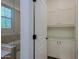 Bathroom showcases a glass-enclosed shower and built in storage adjacent to a door and cabinetry at 20750 N 87Th St # 2115, Scottsdale, AZ 85255