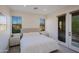 Well lit bedroom featuring a large bed, neutral tones, and views of the neighborhood at 20750 N 87Th St # 2115, Scottsdale, AZ 85255