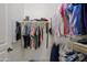 Walk-in closet showcasing ample hanging space with organized clothing and shelving for storage at 20750 N 87Th St # 2115, Scottsdale, AZ 85255